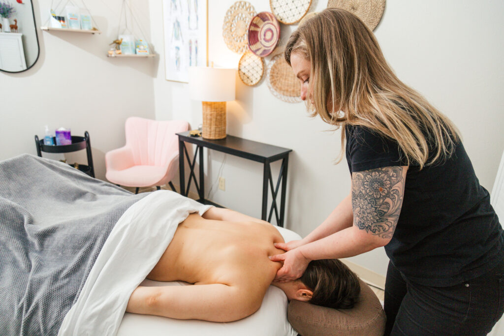 Alta Ulrich, LMT performing neck massage, massage for neck pain, pain relief, chronic pain relief. 